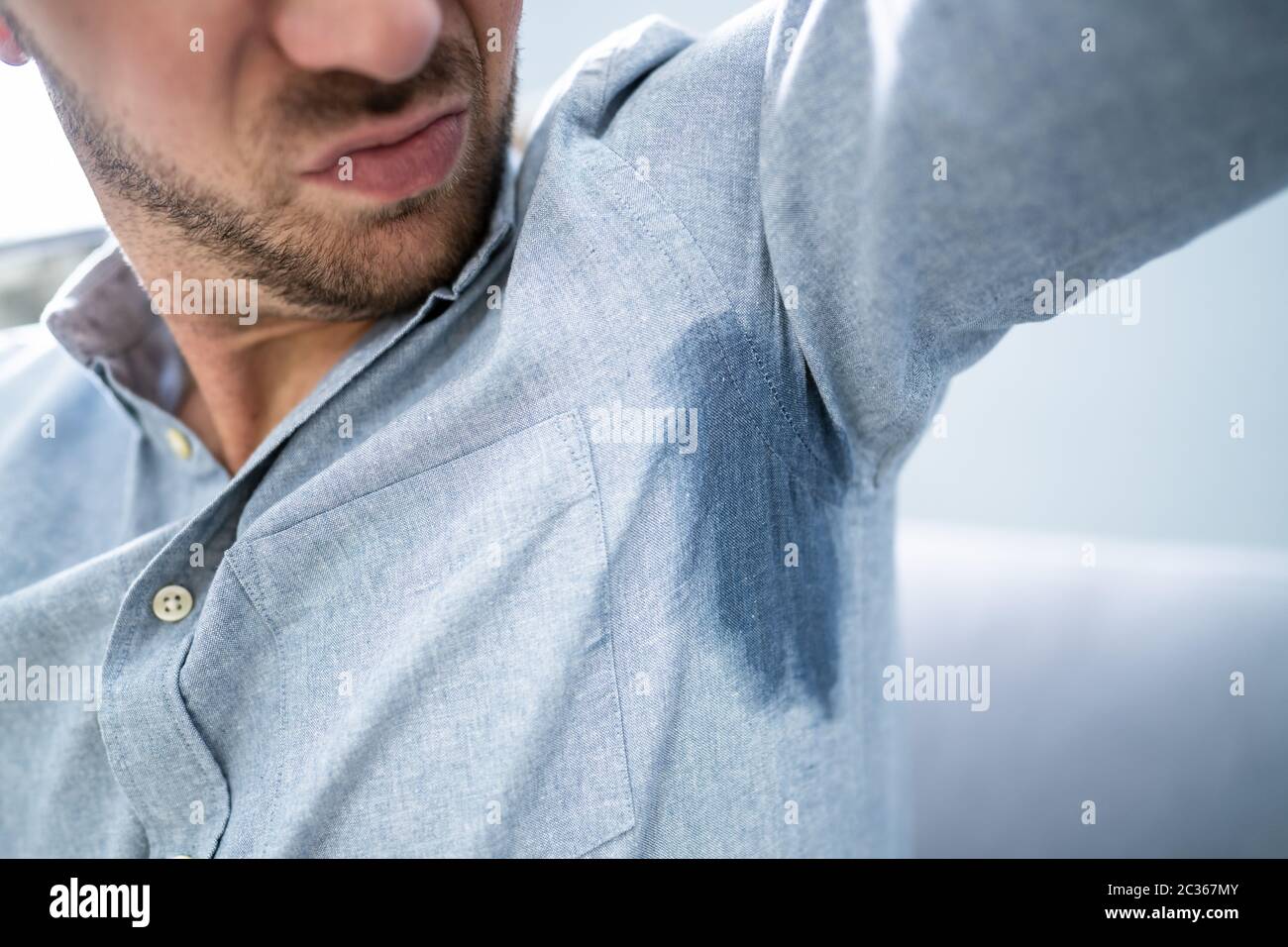 Mature Man Notices His Sweat Under Armpit Stock Photo Alamy