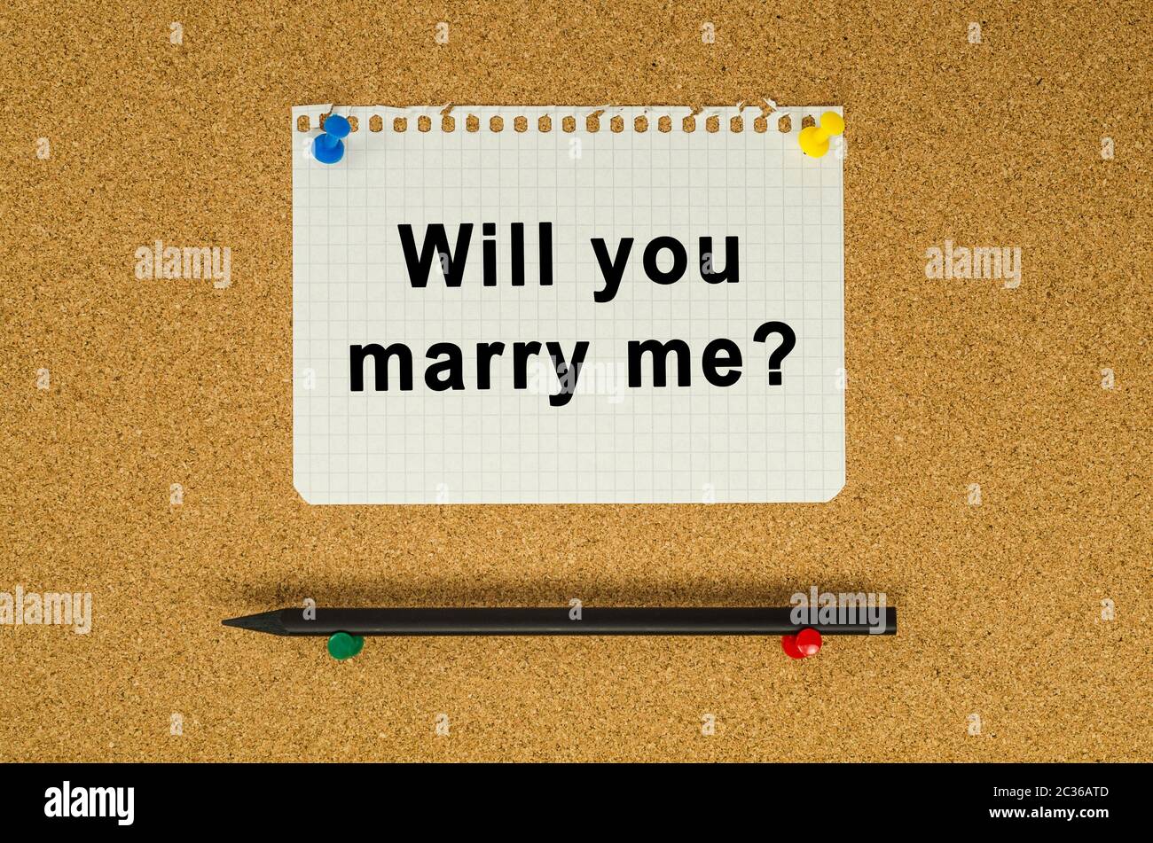 Will you marry me text note message pin on bulletin board Stock Photo