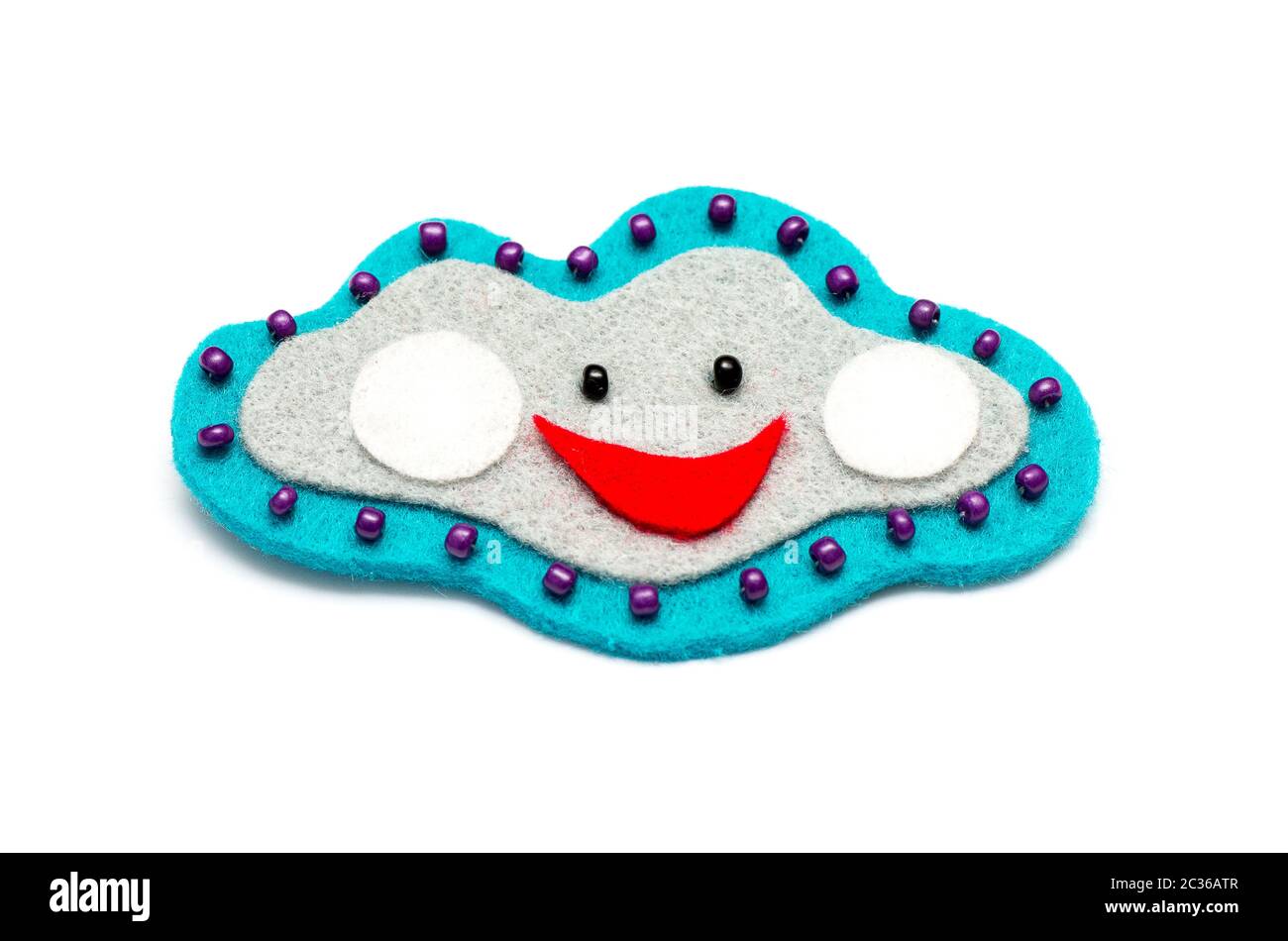 Colorful handmade cloud made from fabric and isolated on the white