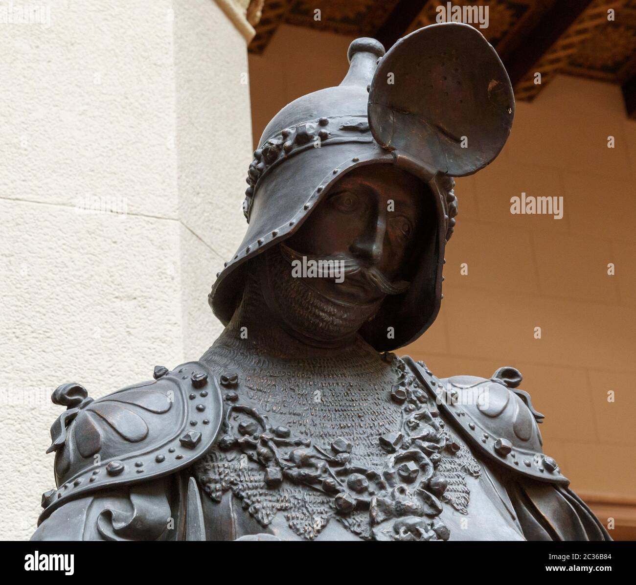 Sculpture of King Arthur old metal statue. Medieval knights armor full size standing warrior