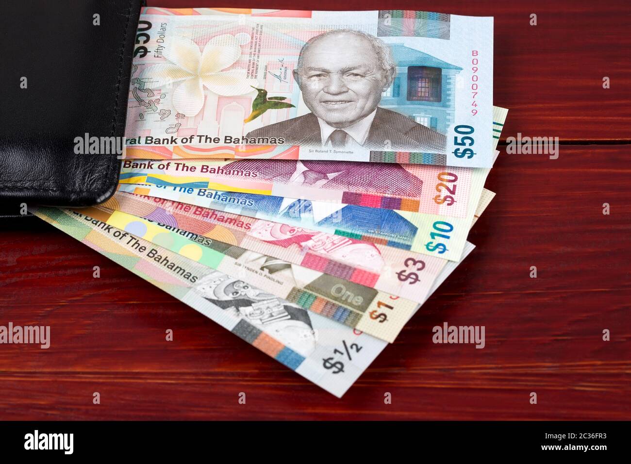 Bahamian dollar in the black wallet Stock Photo Alamy