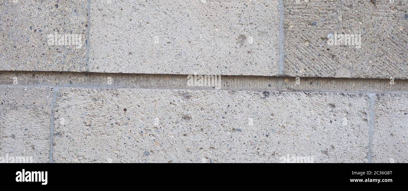 wide grey stone wall useful as a background Stock Photo - Alamy