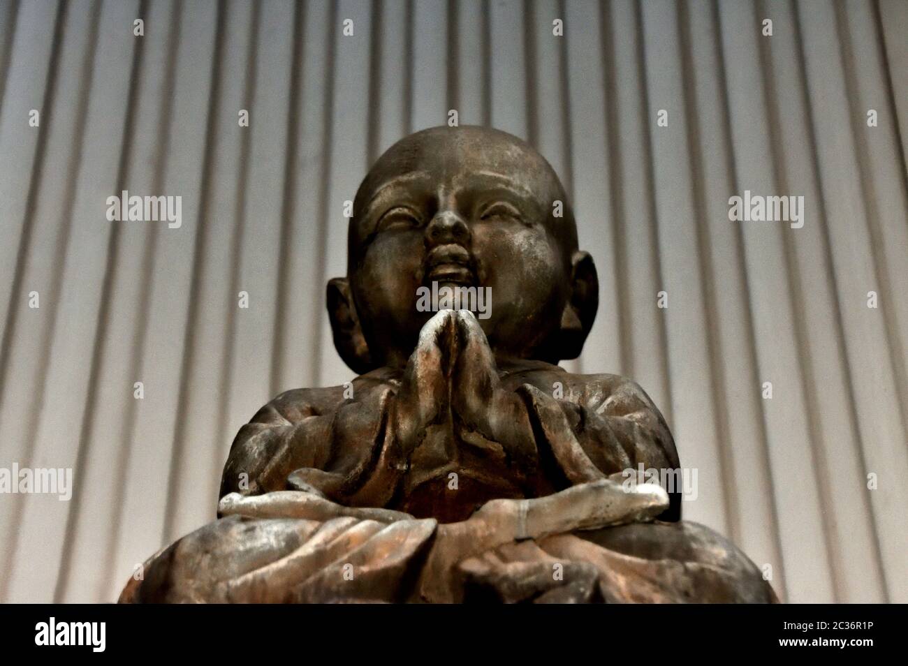 A statue of a young Buddha Stock Photo - Alamy