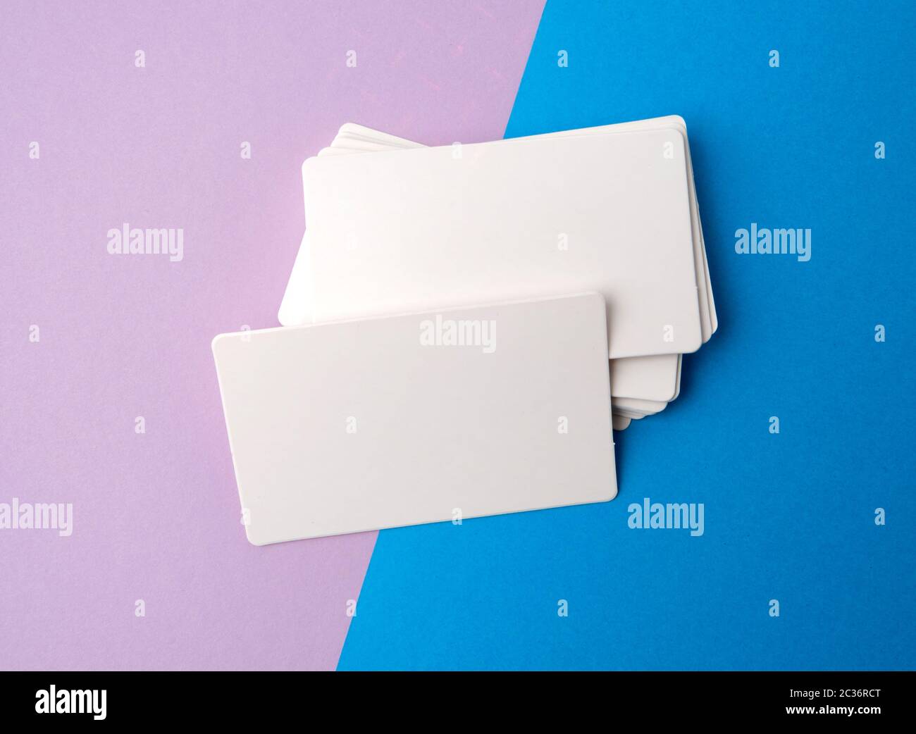 stack of rectangular white blank business cards on a blue background ...