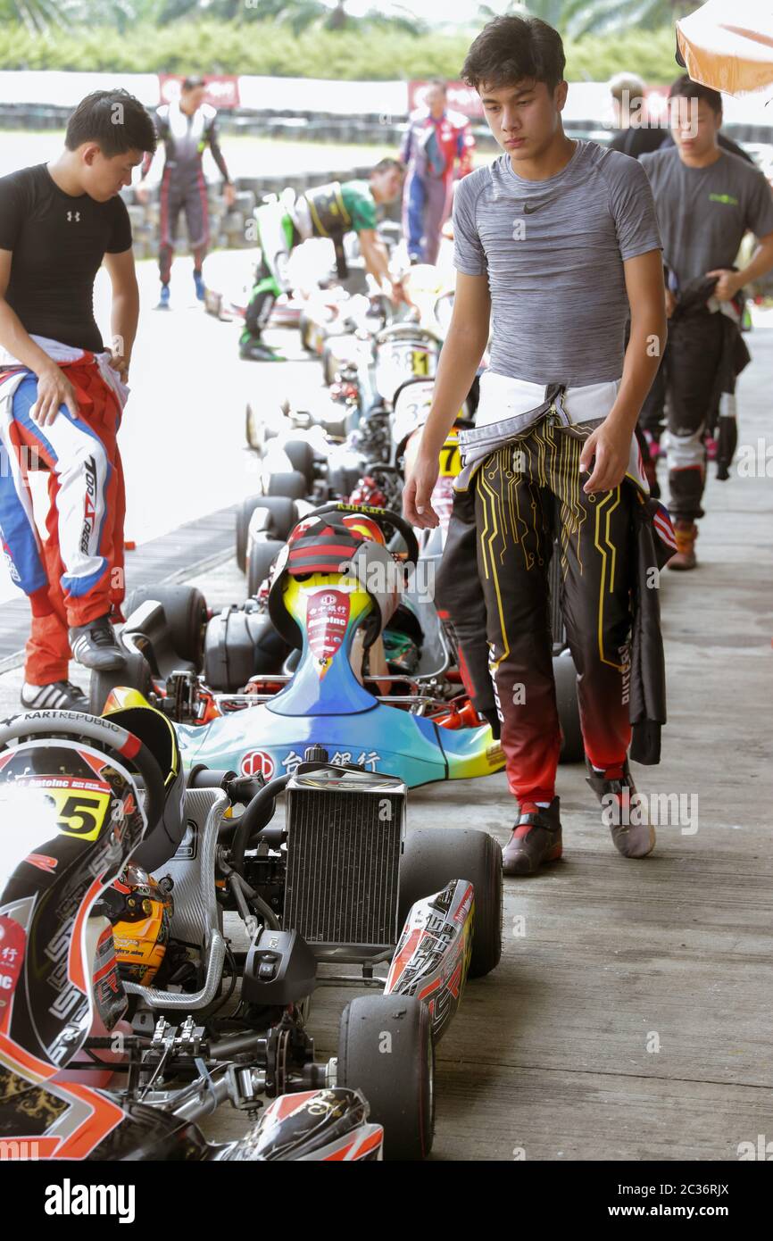 Kart racers getting ready for routine checkout procedure after a race. Stock Photo