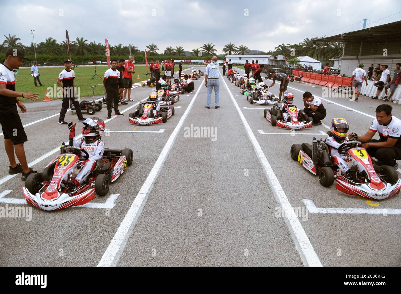 Kart racers getting ready on the starting point of the race track. Stock Photo