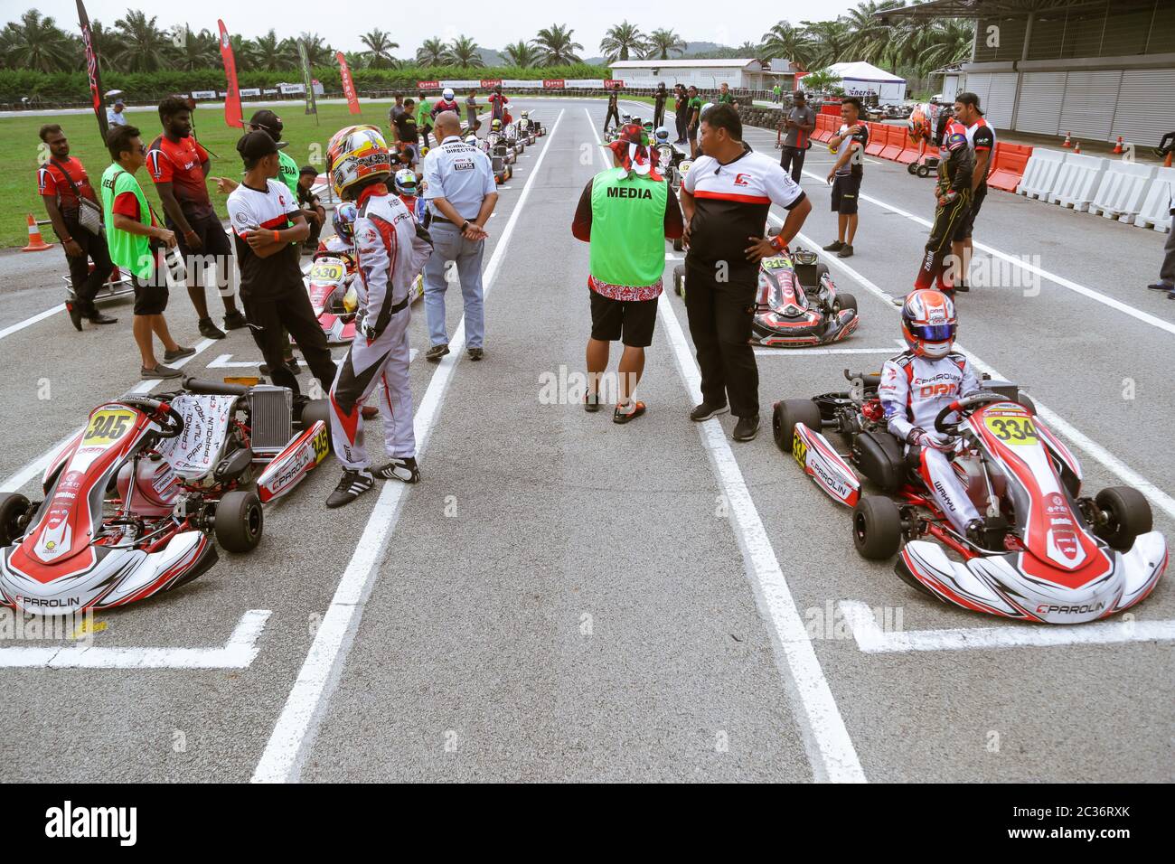 Kart racers getting ready on the starting point of the race track. Stock Photo