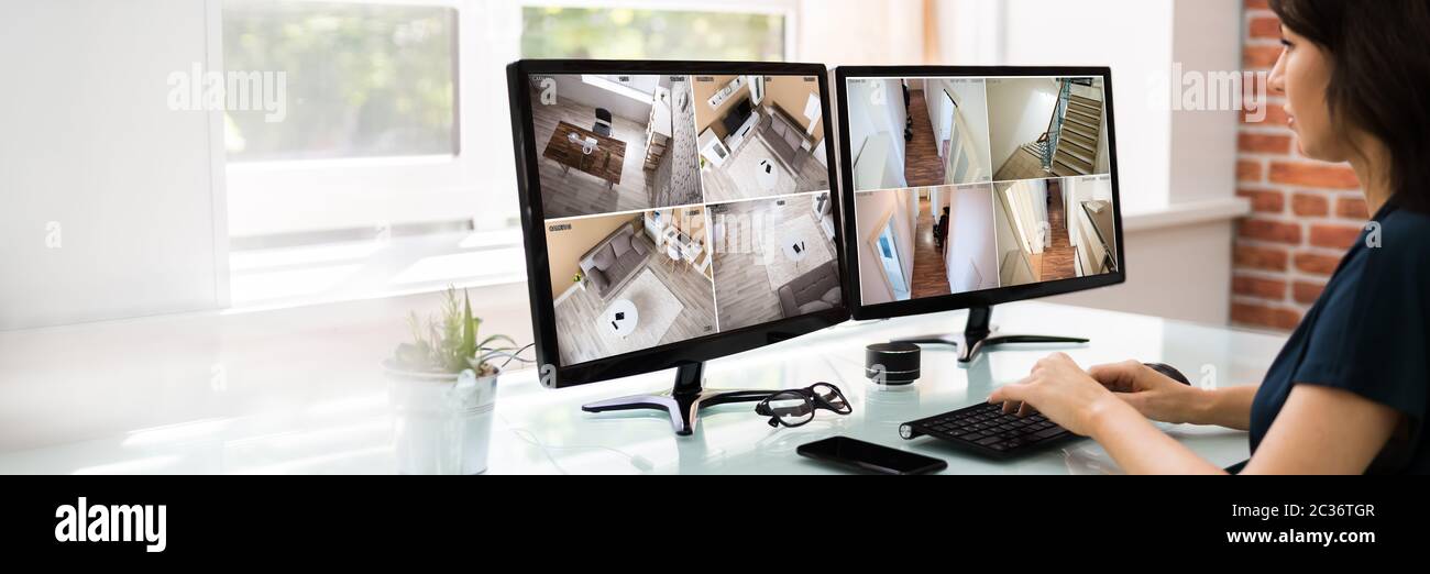 Corporate CCTV Surveillance On Multiple Monitor Screens Stock Photo