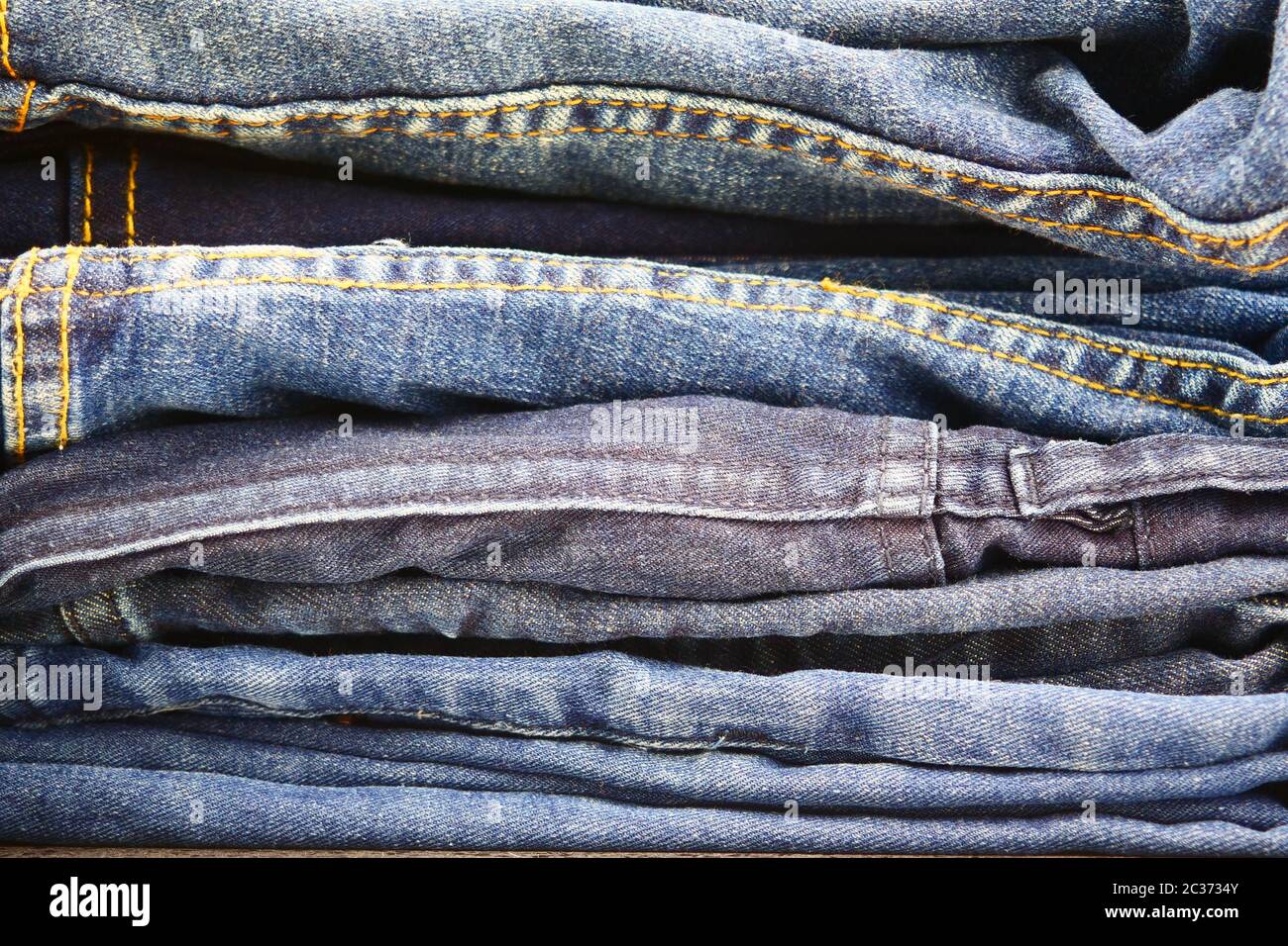 stack of blue jeans Stock Photo