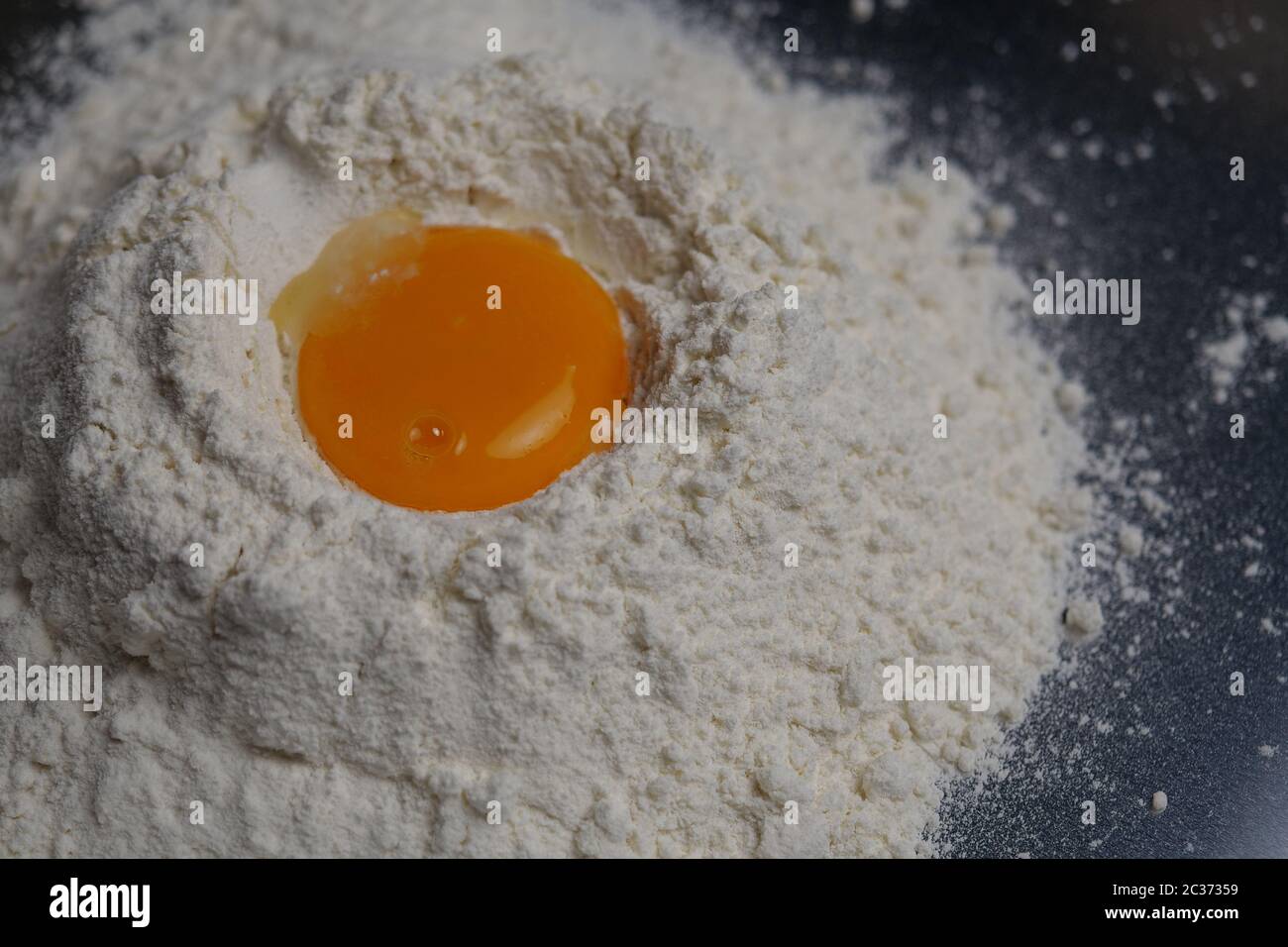 egg yolk on flour Stock Photo