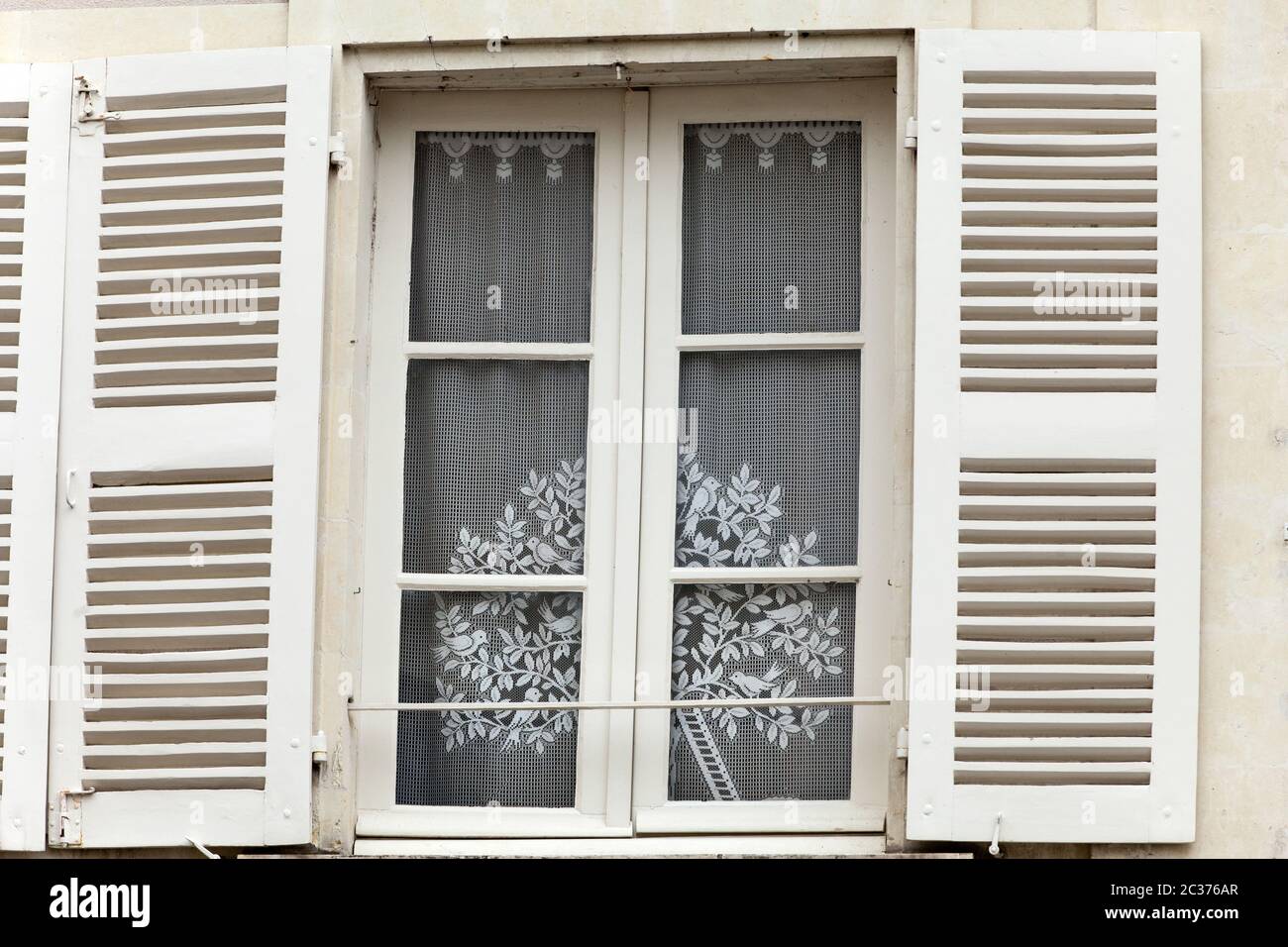 White window with shutters Stock Photo - Alamy
