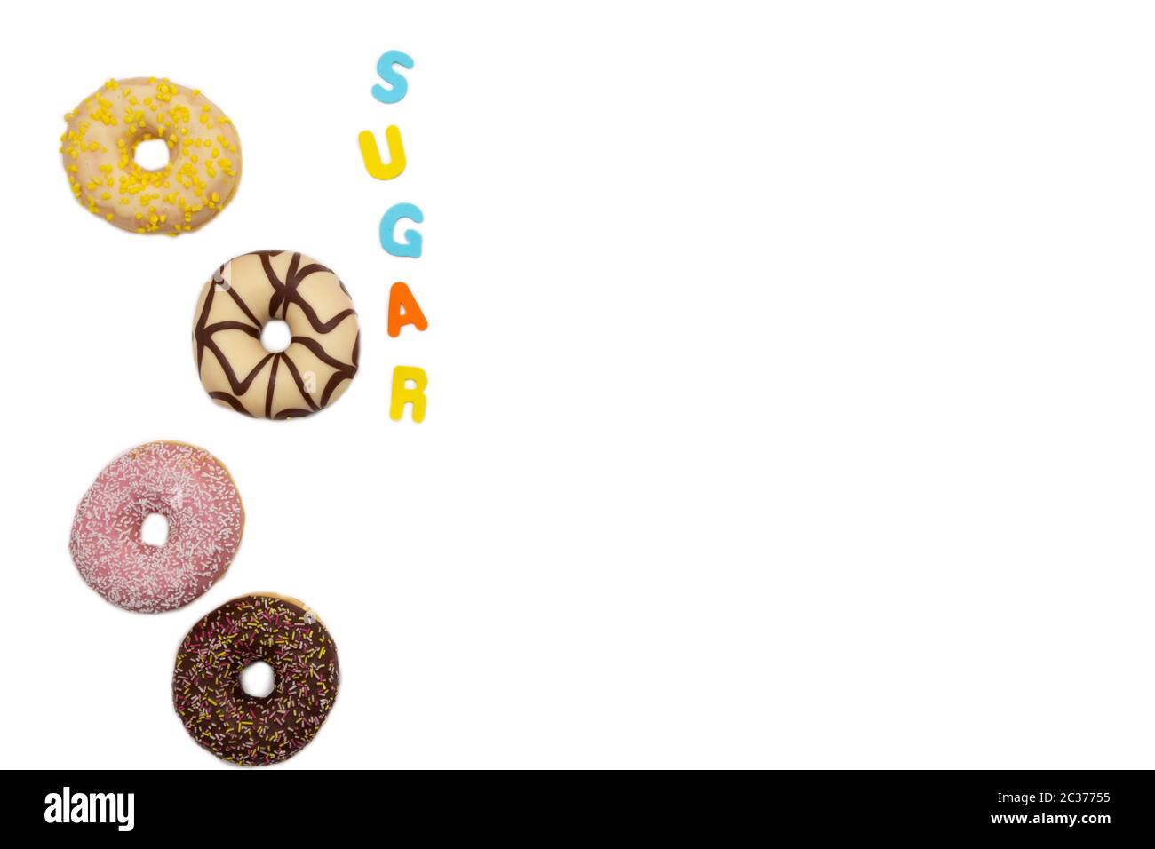 various colored delicious donuts on white background, with the word sugar space for text Fastfood sweet concept Stock Photo