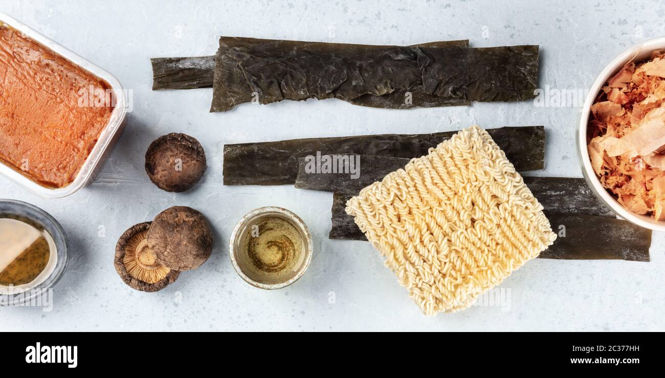 Ramen ingredients panorama. Dried sea vegetable kelp, soba instant noodles, red miso paste, tuna