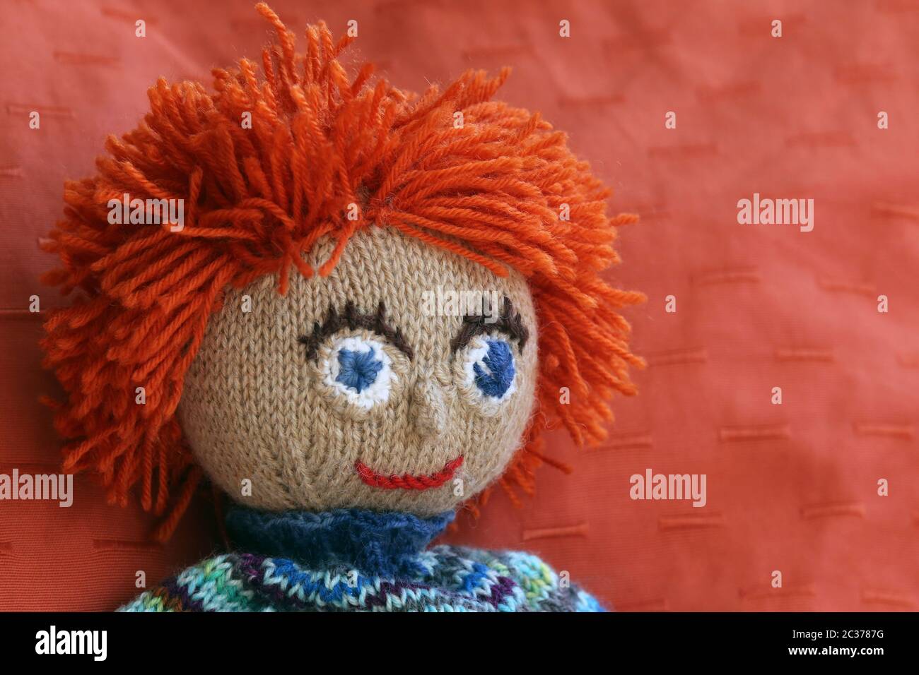 Hand-knitted doll made of wool Stock Photo