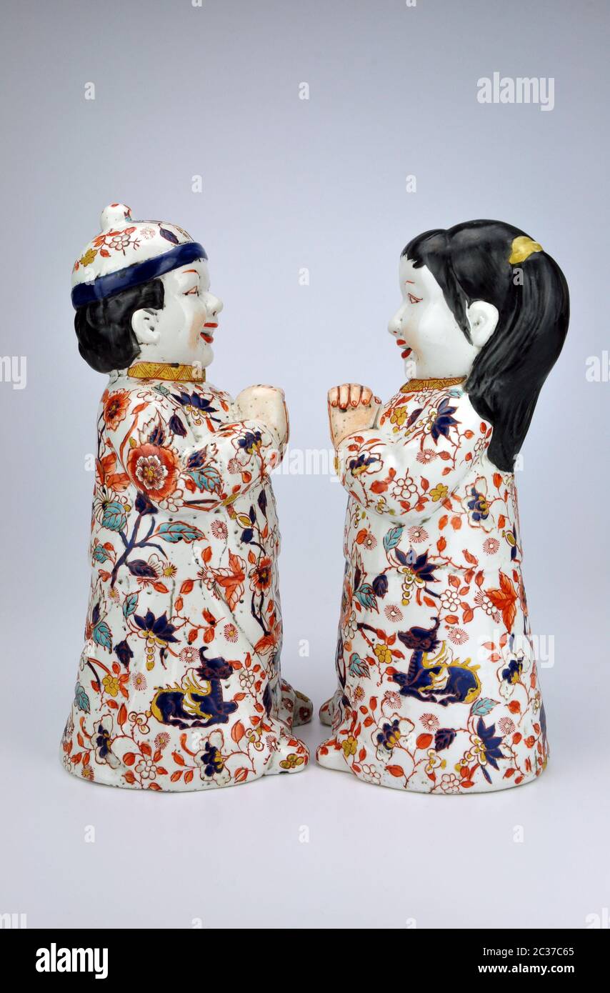 Matched pair of Chinese Lucky Children porcelain figurines enamelled in