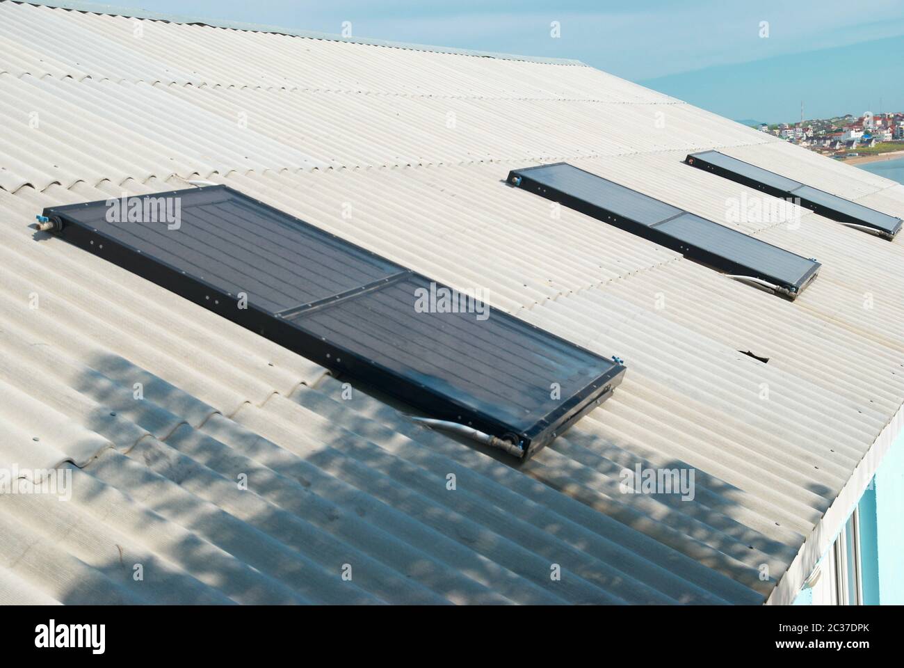 Solar water heating system on the house roof Stock Photo - Alamy