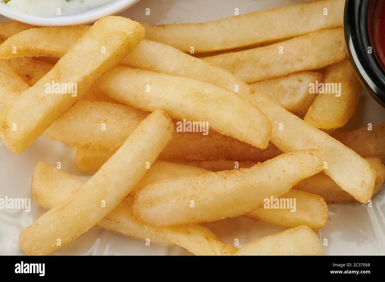 Delicious french fries macro close up view. Unhealthy fastfood theme Stock Photo