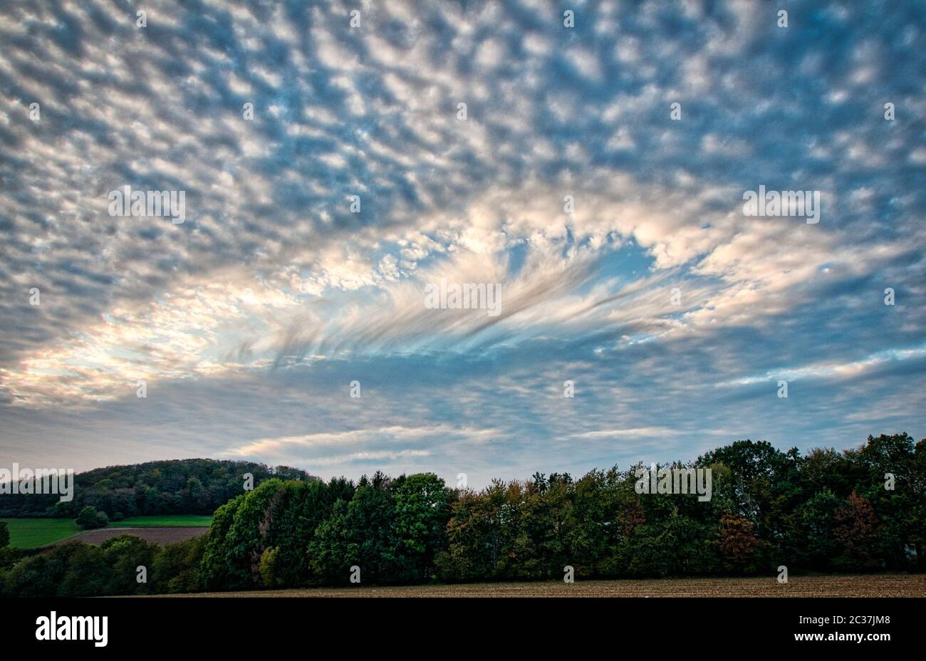 a special hole punch cloud in a blue sky Stock Photo