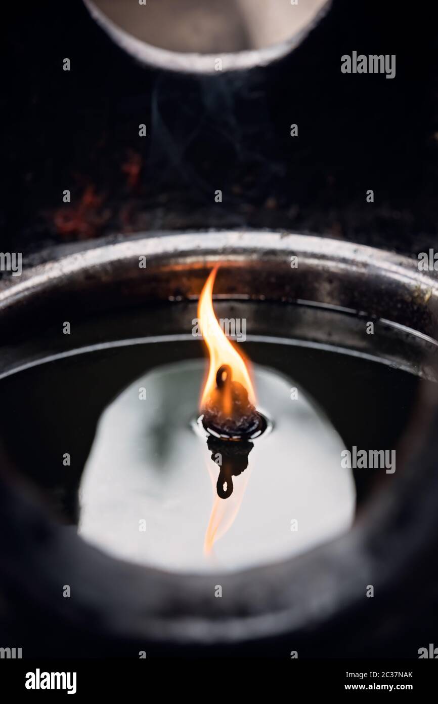 Fire burning in the memorial candle in the Wenshu Monastery, Chengdu, China Stock Photo