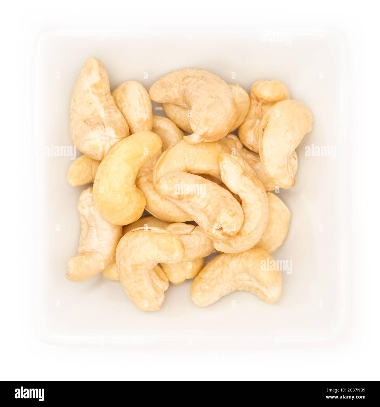 Cashew nut in a white square bowl in top view Stock Photo