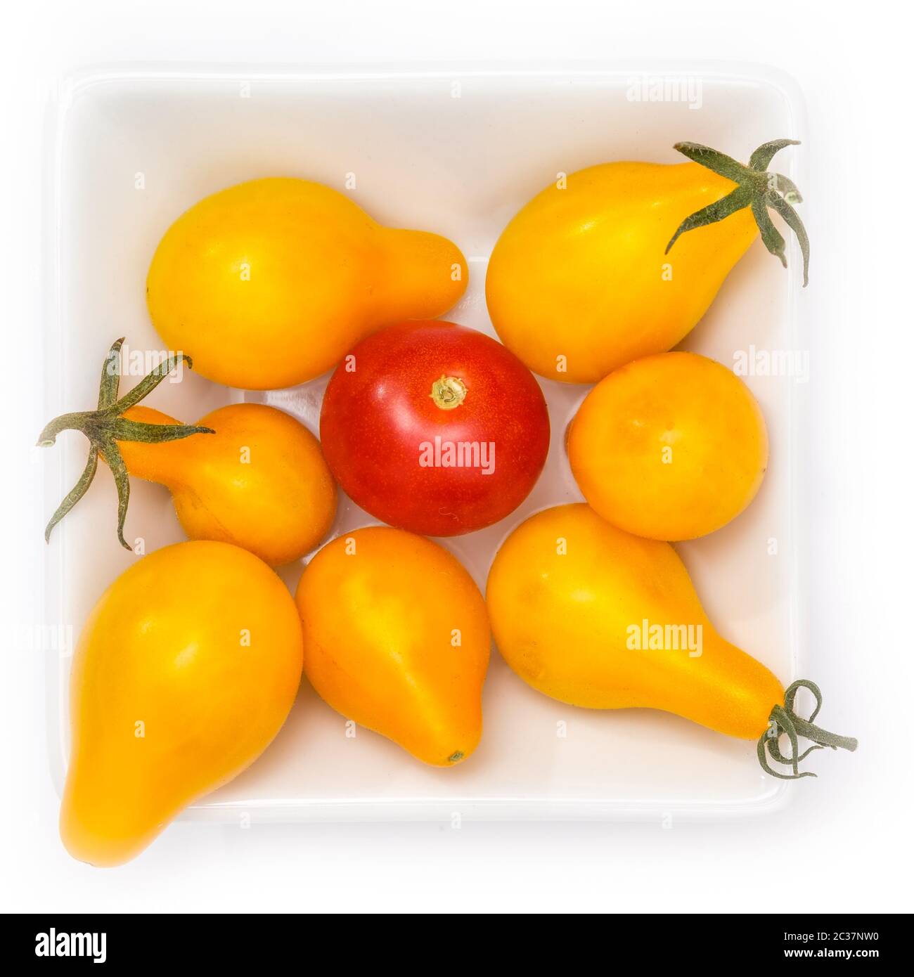 Red and yellow cherry tomatoes in a bowl in top view Stock Photo - Alamy