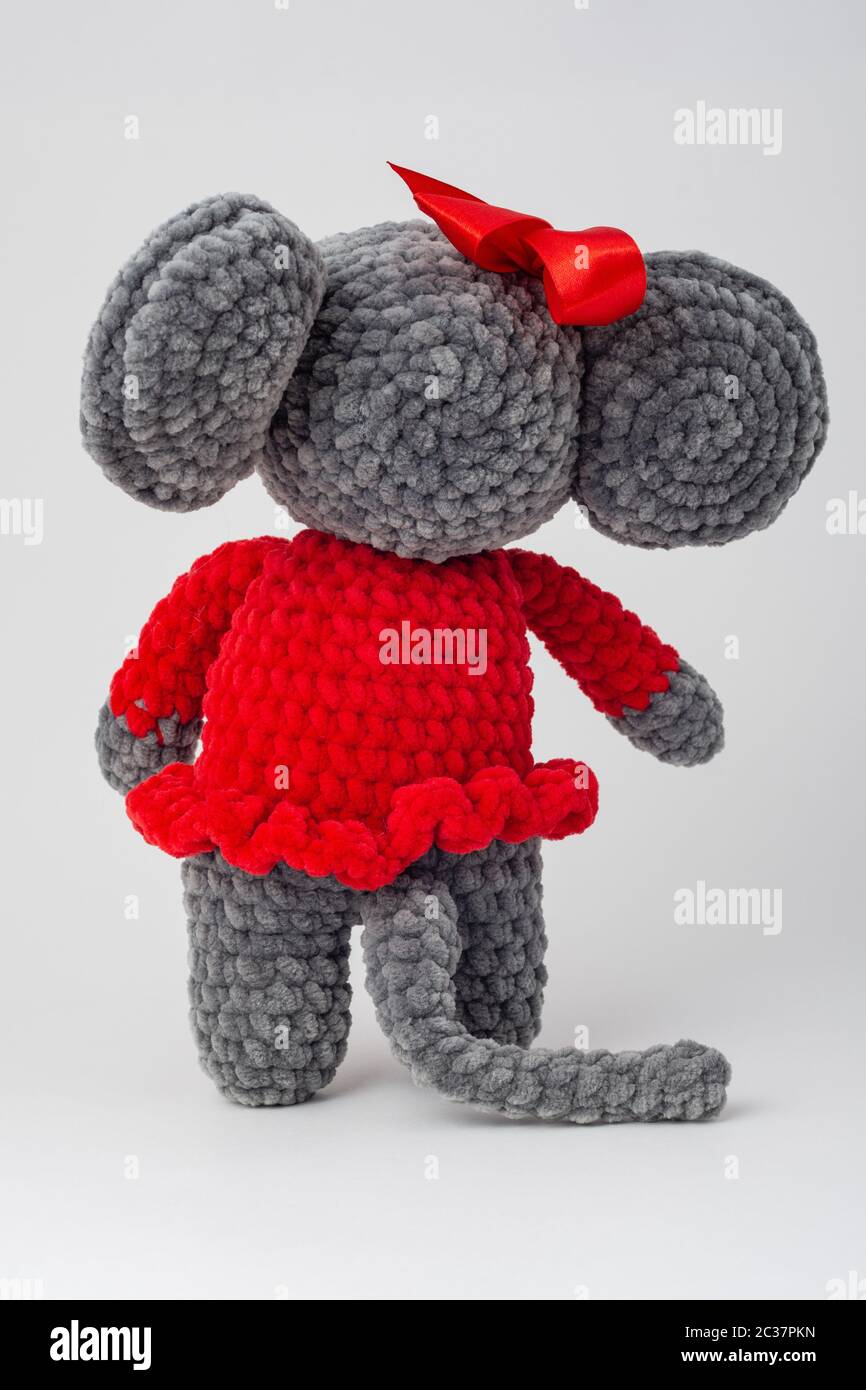 Plush mouse with a red bow on its head, Rear view Stock Photo