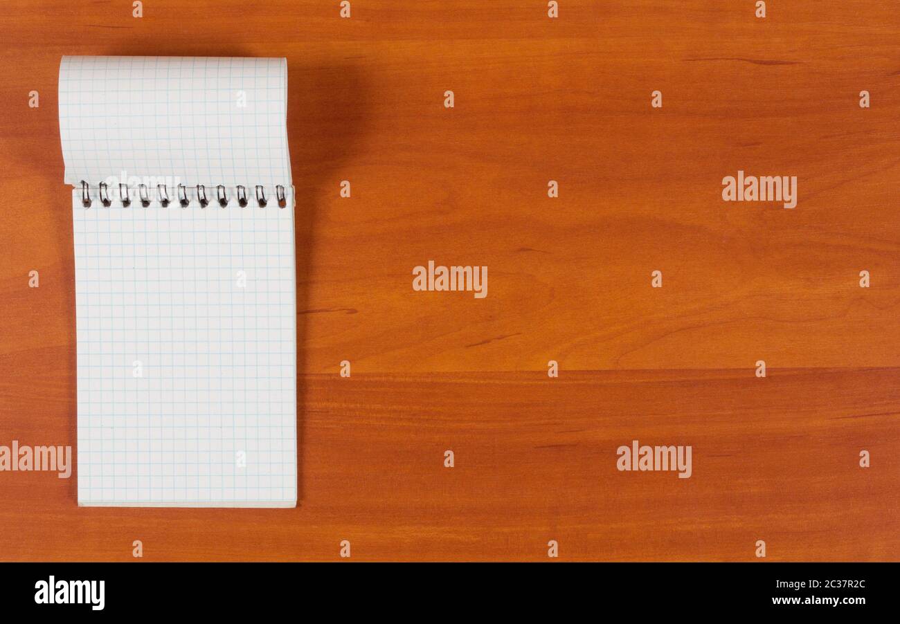 Open Notebook Chekered Open white checkered notebook for notes on the wooden background Stock ...