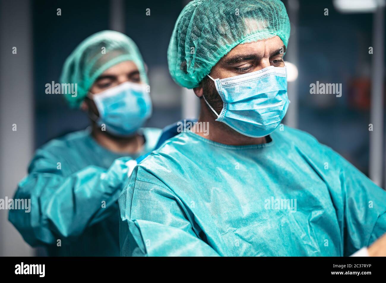 Doctors preparation for surgical operation in hospital during corona virus outbreak - Medical workers getting ready for fighting against coronavirus Stock Photo