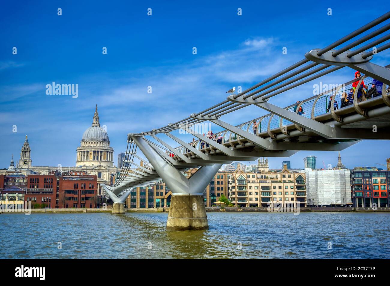 St. Paul's Cathedral across Millennium Bridge and the River Thames in London, UK Stock Photo