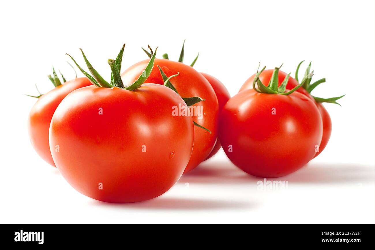 Red ripe tomatoes isolated on white background Stock Photo - Alamy