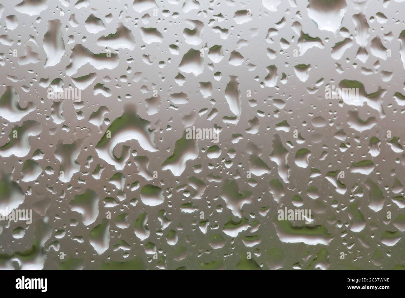 Glass surface with water drops in a rainy day Stock Photo - Alamy