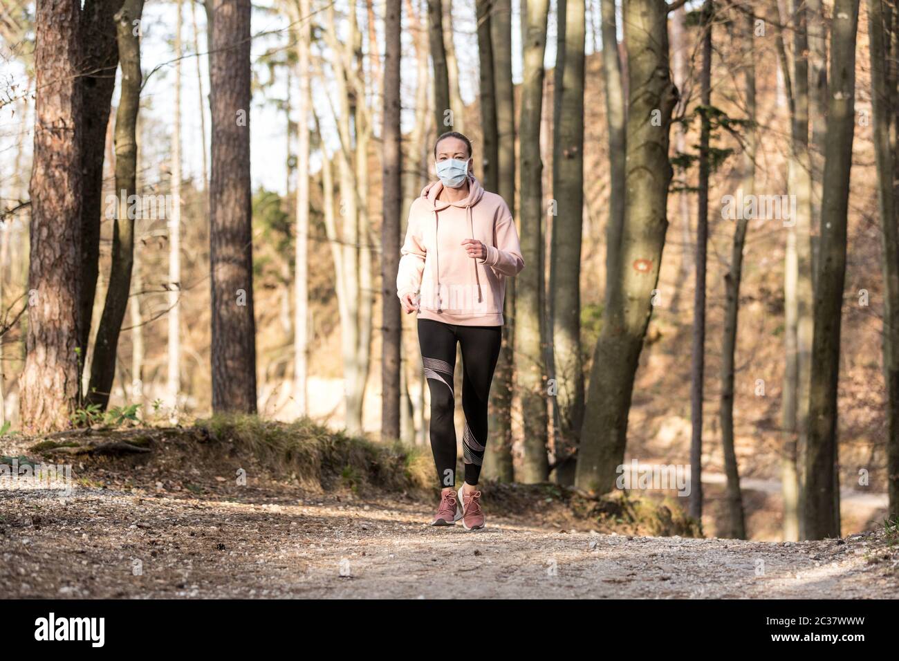 Woman was wearing a mask and running on air pollution Stock Photo - Alamy