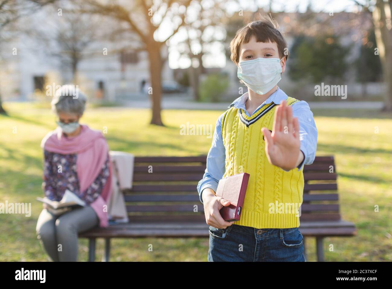 Boy Giving Stop Sign Asking For Social Distancing To Protect His Grandmother Stock Photo Alamy