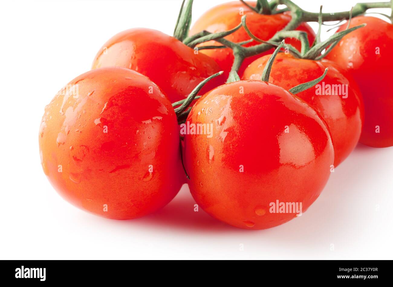 Bunch of ripe tomatoes isolated on white background Stock Photo - Alamy