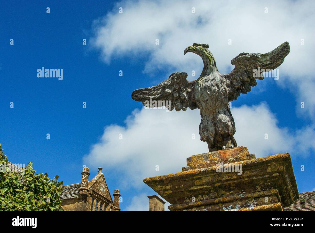 Carved stone eagle on a gatepost at the entrance to Mapperton House, a Jacobean manor house near Beaminster, Dorset, UK Stock Photo