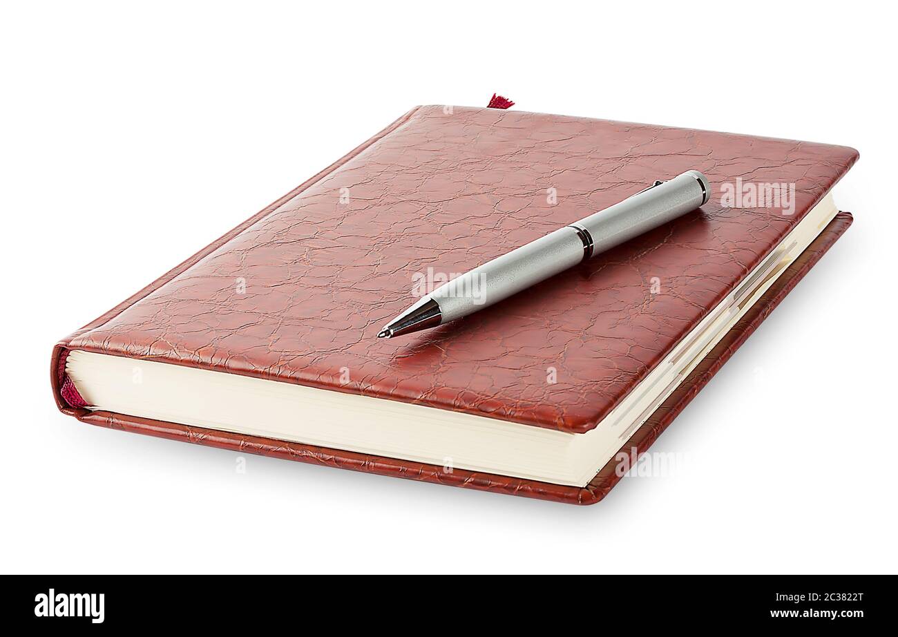 Diary with a pen lying on it isolated on a white background Stock Photo