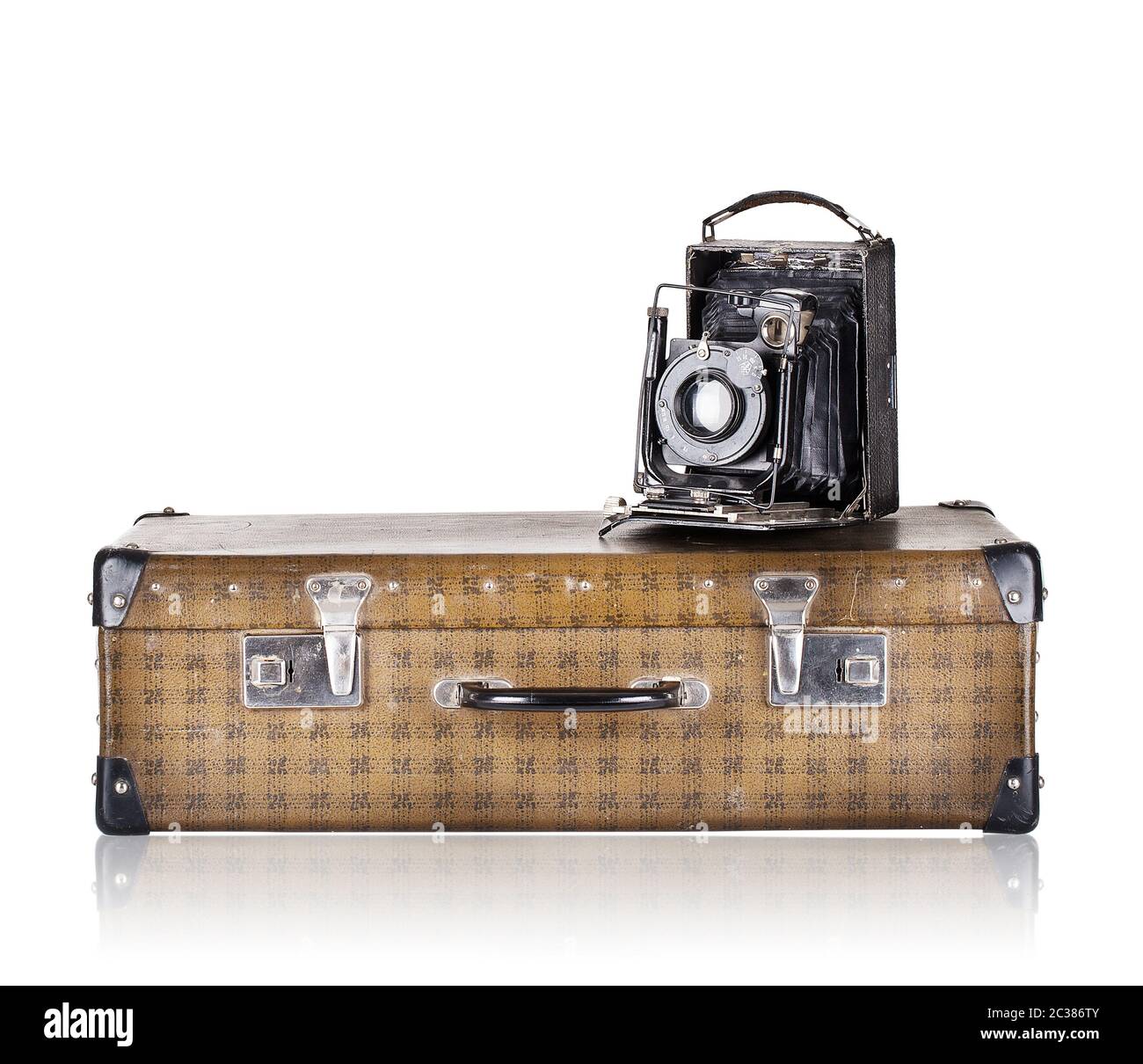 The suitcase with old camera isolated on white background Stock Photo