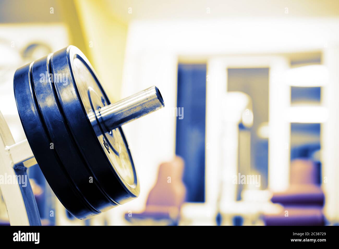 Rubber wheels for barbell on background blur window Stock Photo - Alamy