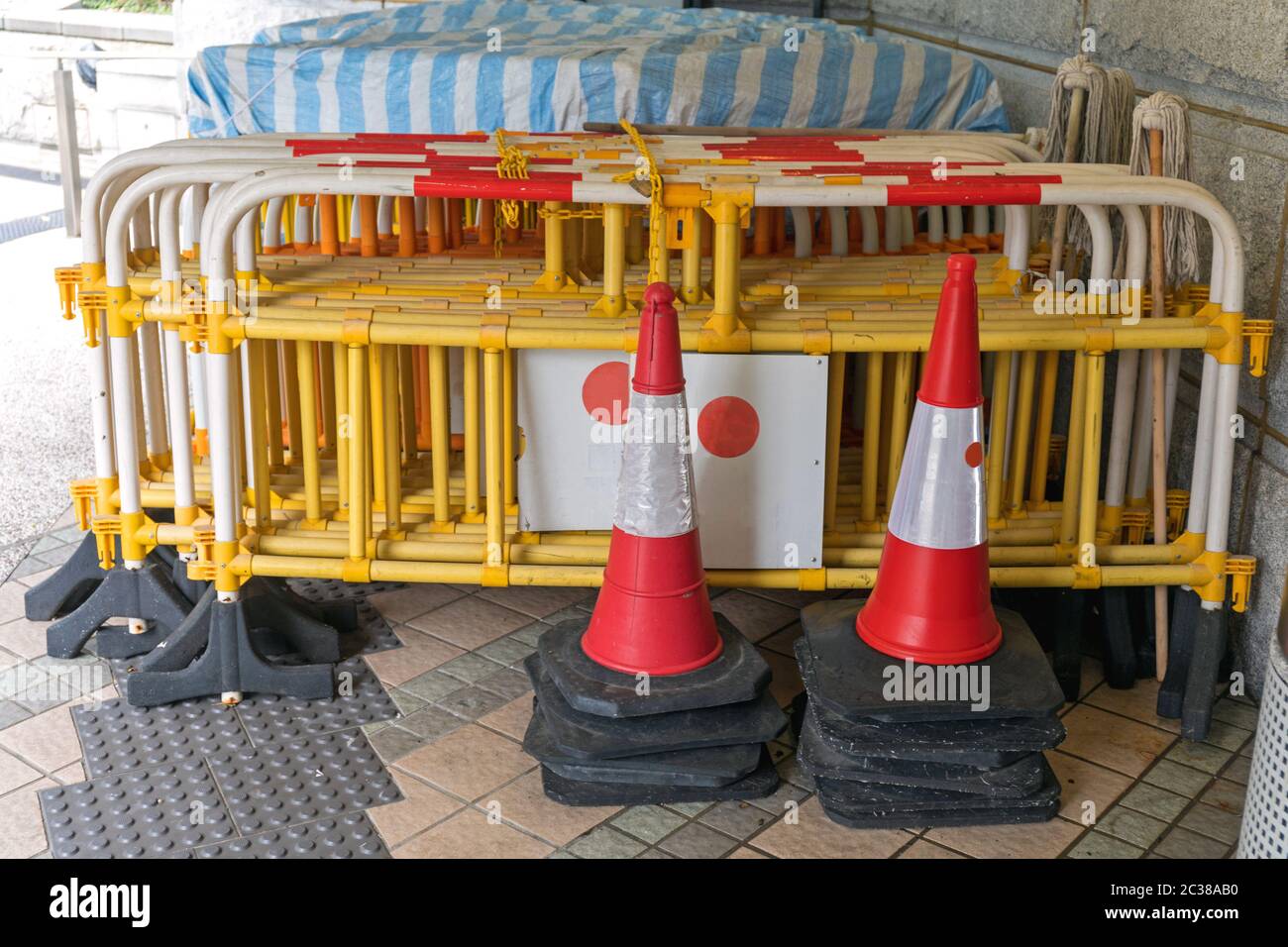 Stacked Traffic Cones and Construction Barriers Barricades Stock Photo