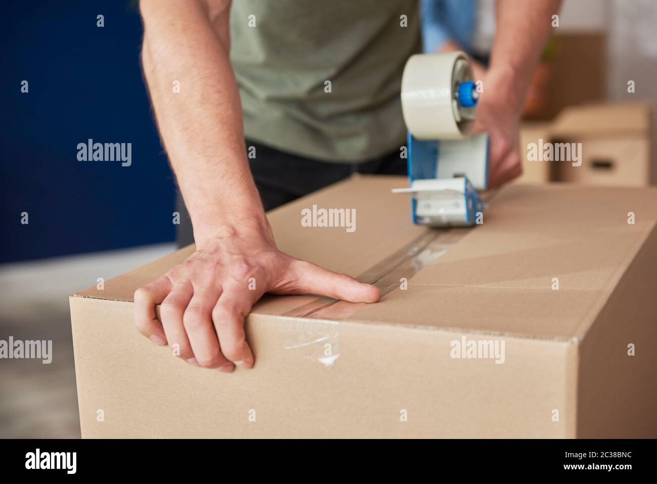 Detail of packing cardboard boxes while moving house Stock Photo Alamy