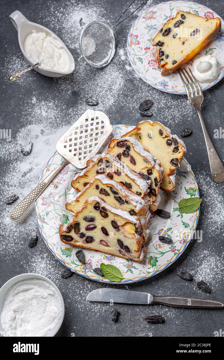 Cottage cheese pie with raisins sprinkled with powdered sugar. Stock Photo