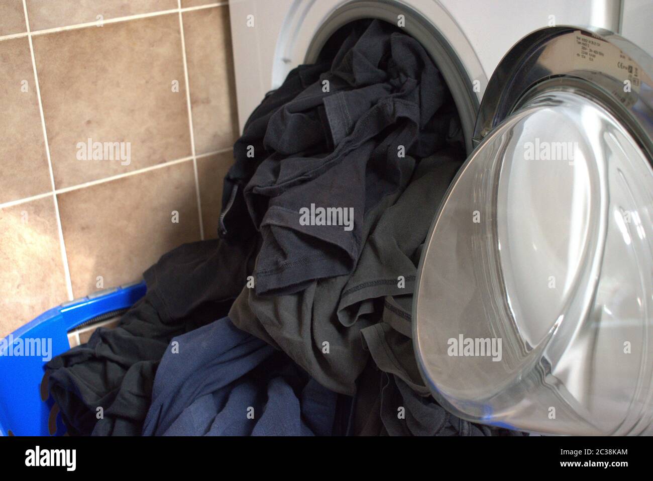 Dirty shirts in a washing machine Stock Photo Alamy