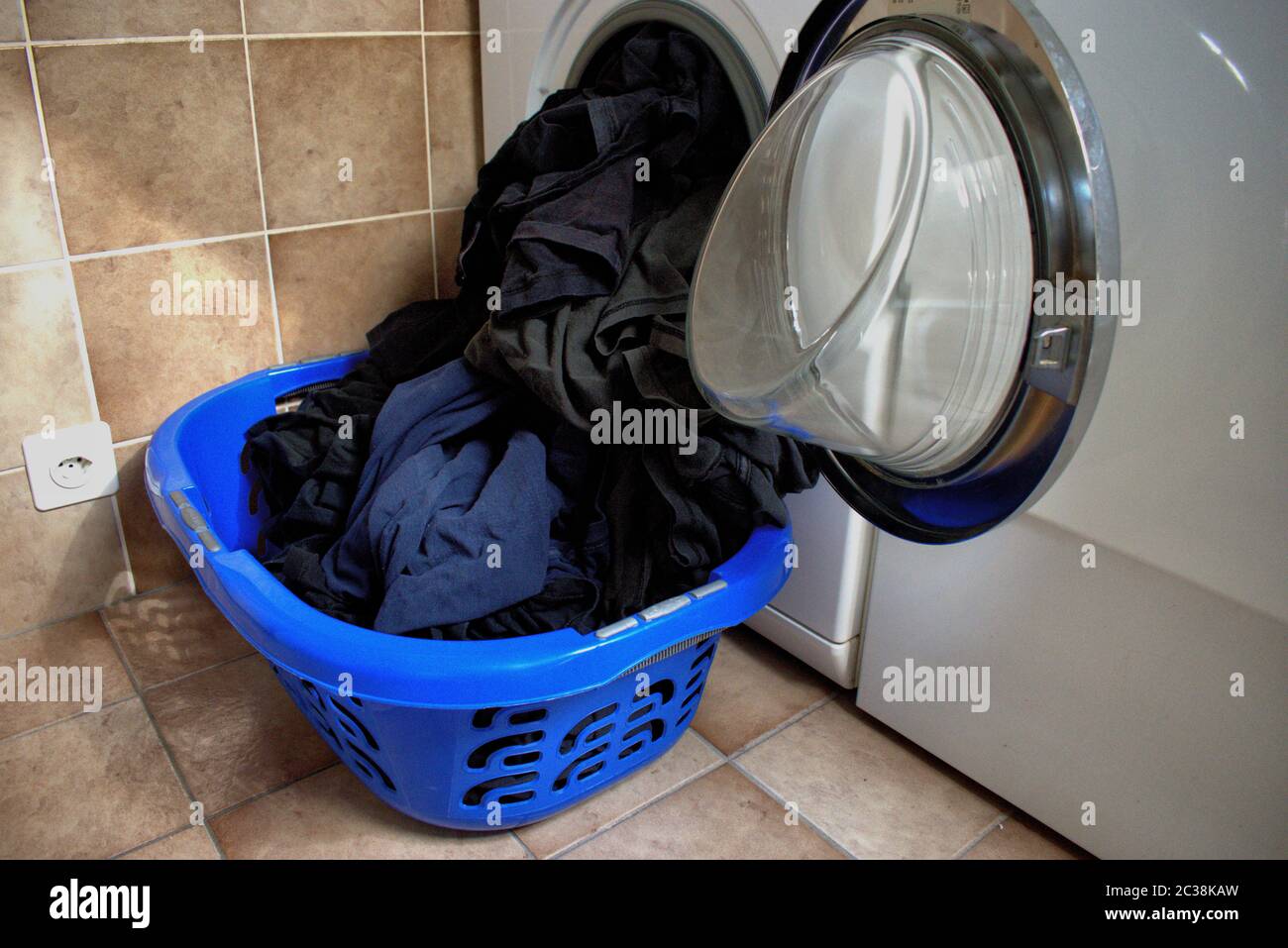 Dirty clothes in washing machine hires stock photography and images