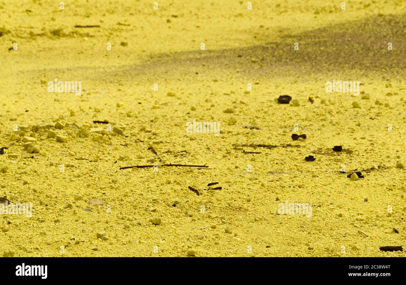 Sulfur powder on floor. Toxic waste from industry. Yellow powder of
