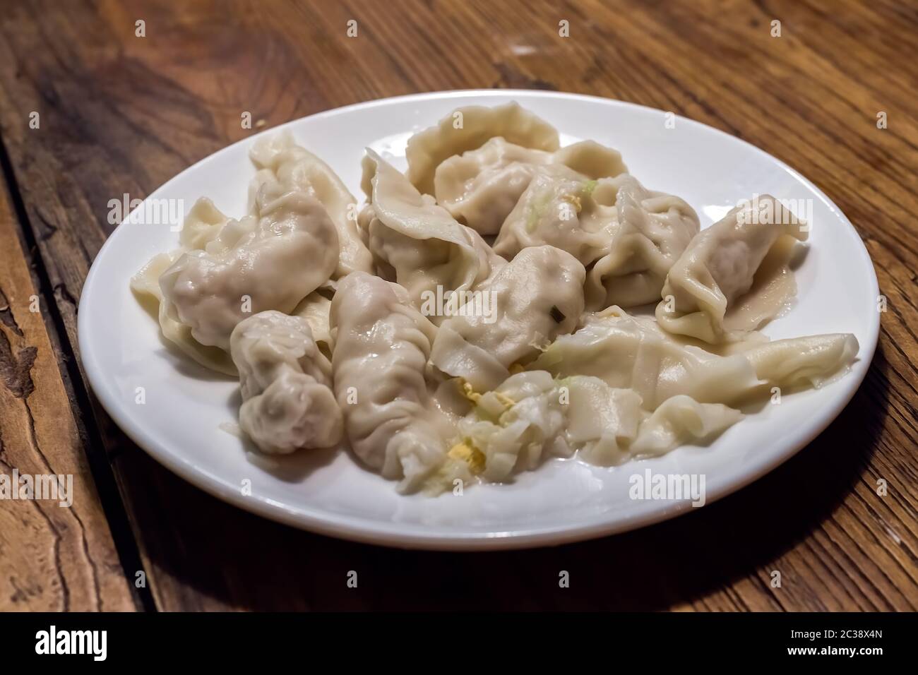 Plate full of freshly cooked chinese dumplings Stock Photo