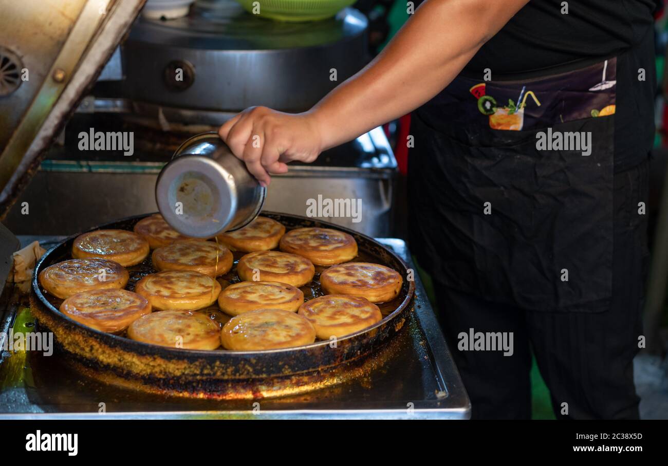 Making bread pancakes in Xian Stock Photo