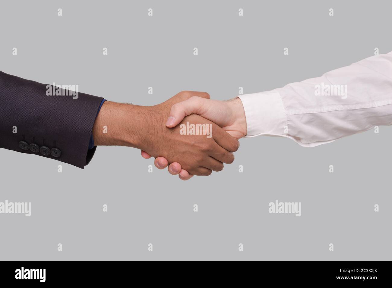 Hand Shake White and Black Businessmen. International Friendship hand shake. Black Lives Matter Stock Photo