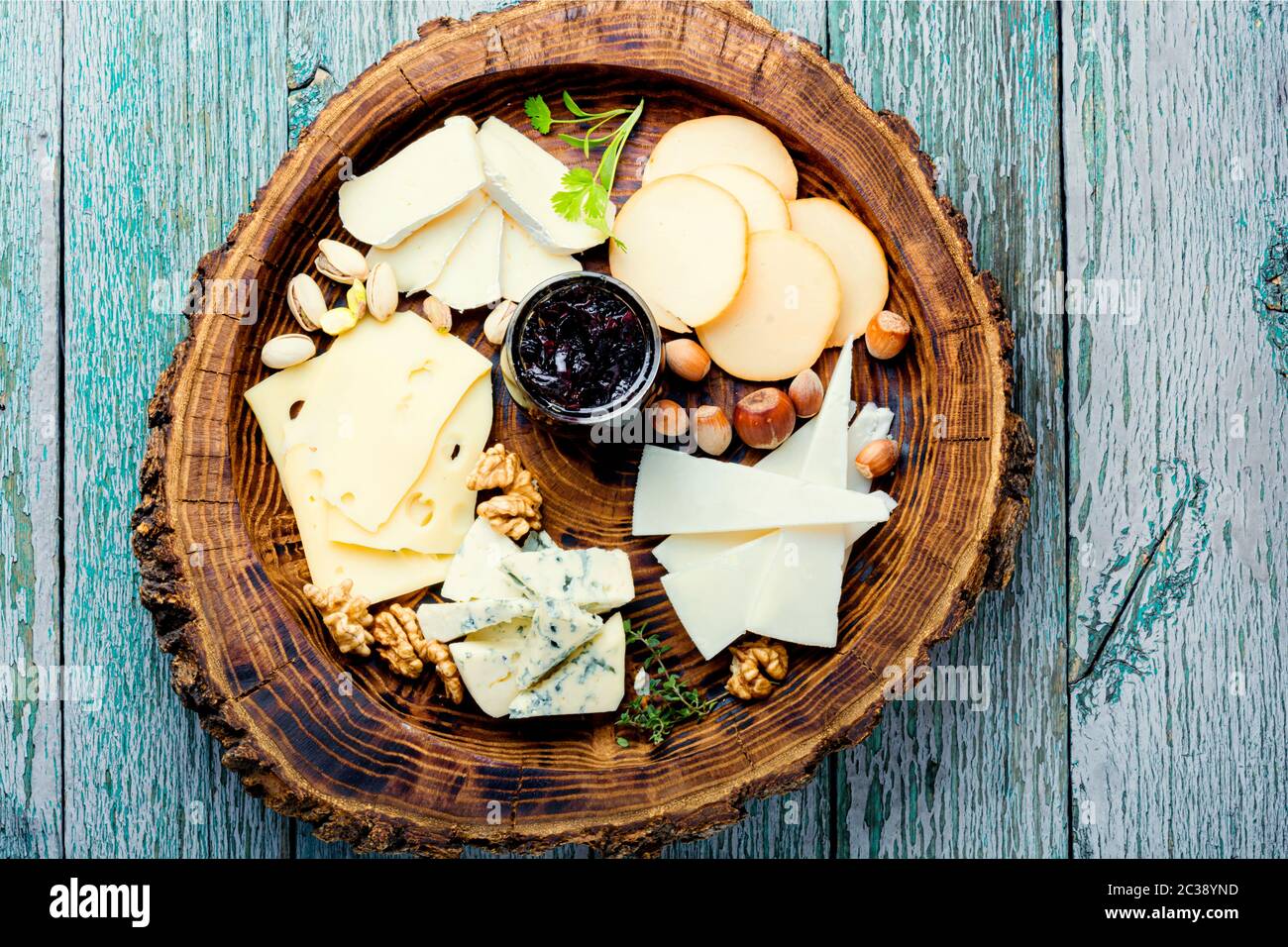 Delicious cheese on the wooden table.Different kinds of cheeses Stock ...