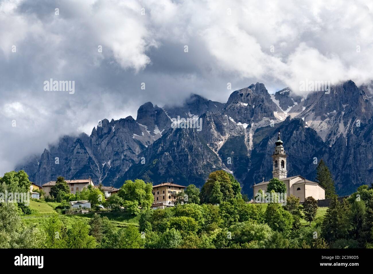 The village of Parrocchia and in the background Mount Carega of the Piccole Dolomiti. Vallarsa, Trento province, Trentino Alto-Adige, Italy, Europe. Stock Photo