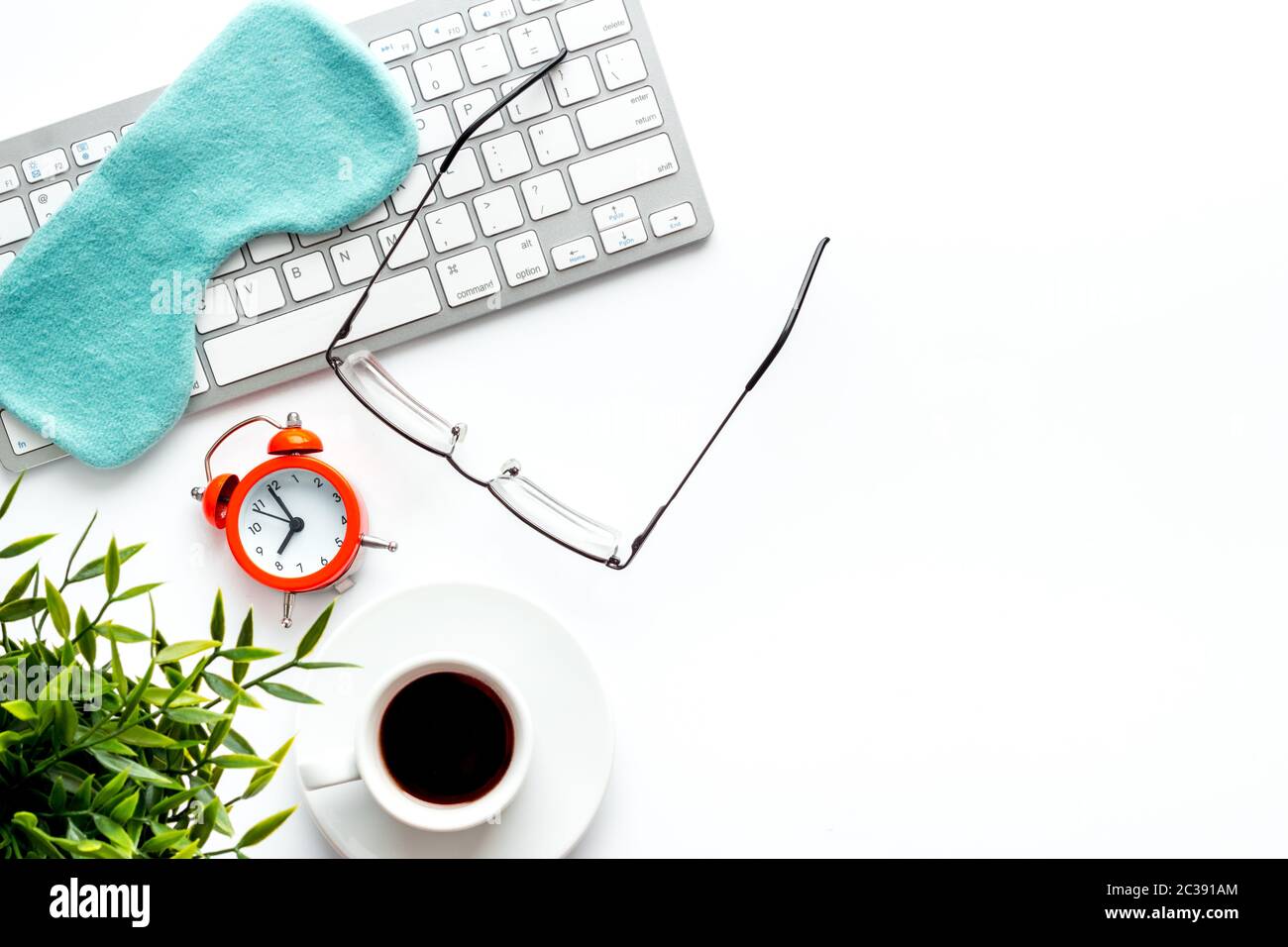 insomnia at work. Sleep mask on white office desk top view copy space